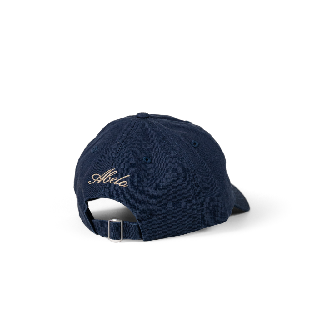 The Eye Cap in navy, back view with Abelo embroidery and adjustable strap