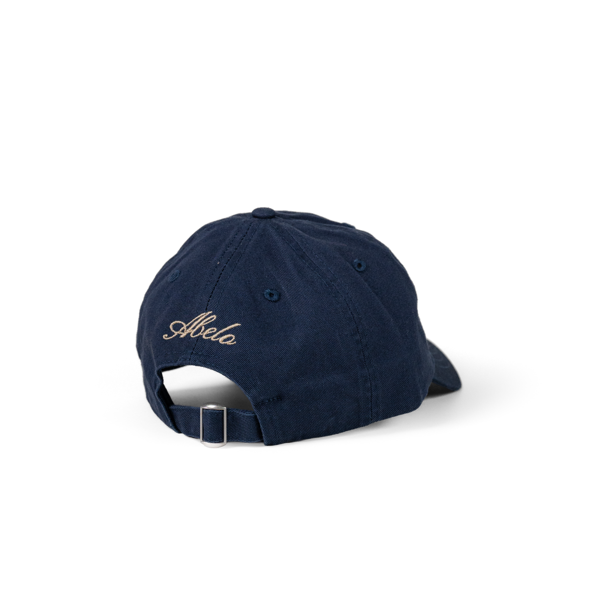 The Eye Cap in navy, back view with Abelo embroidery and adjustable strap