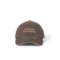 Laughter in the Dark Cap in washed brown with 'I eat books for breakfast' embroidered on the front